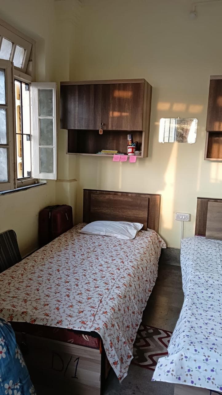 Double bed hostel room with study area